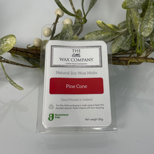 Packaging of The Little Wax Company Pine Cone wax melts with decorative mistletoe in the background.