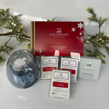 The Little Wax Company product set with wax melt packs and a clear candle holder on a white background.