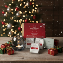 Wax melts and packaging with a Christmas tree in the background